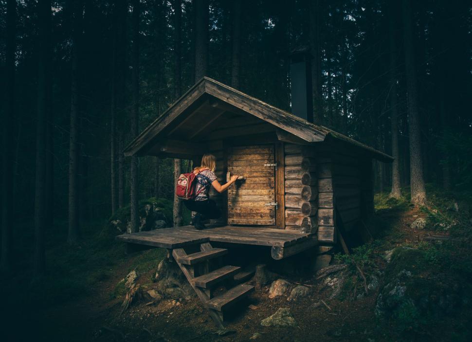 Free Image of Person in cabin looking at smartphone 