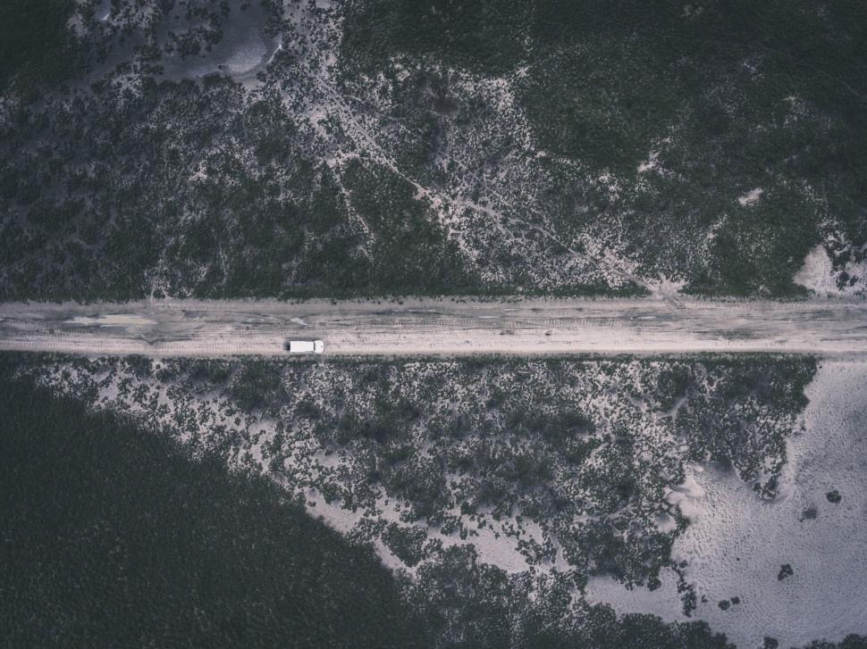 Free Image of Lone truck on an isolated desert road 