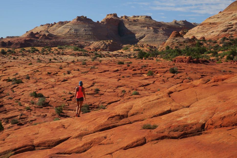 Free Image of Person hiking in rocky desert terrain 