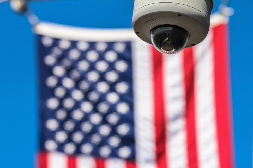 Free Image of Surveillance camera overlooking American flag 