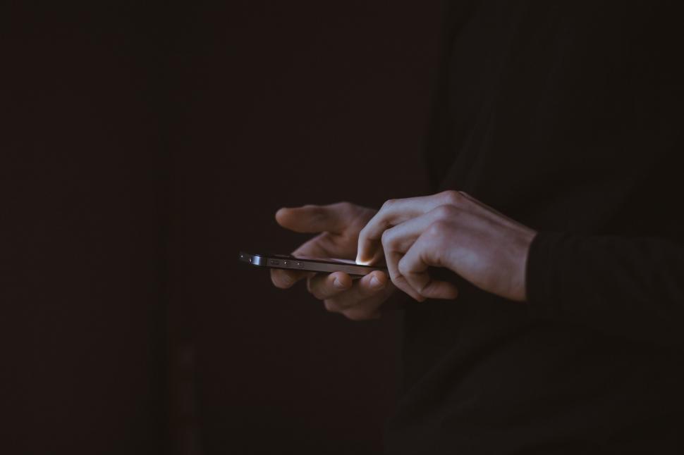 Free Image of Close-up of hands using a smartphone 