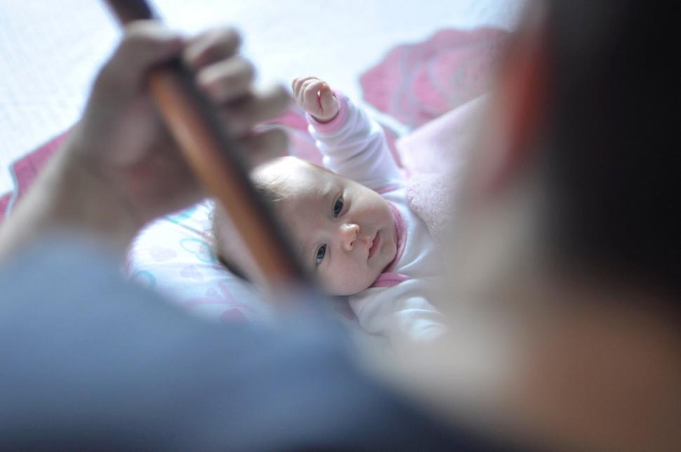 Free Image of Mother and baby during a softly lit moment 