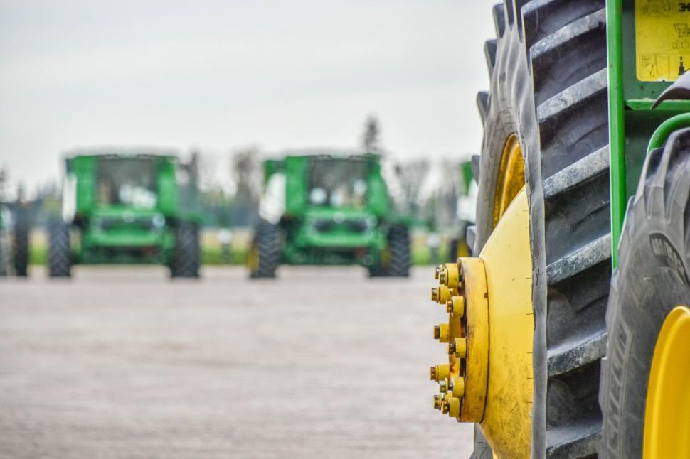 Free Image of Row of tractors on an agricultural field 