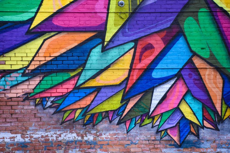 Free Image of Vibrant graffiti art on a brick wall 