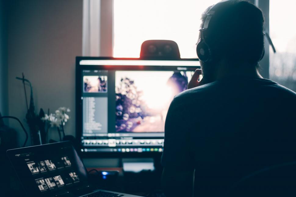 Free Image of Person working on computer with dual screens 