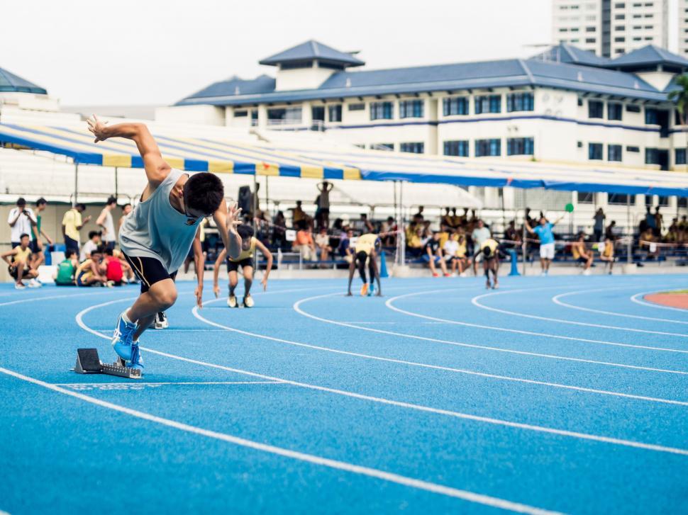 Free Image of Athlete starting a race on a track 