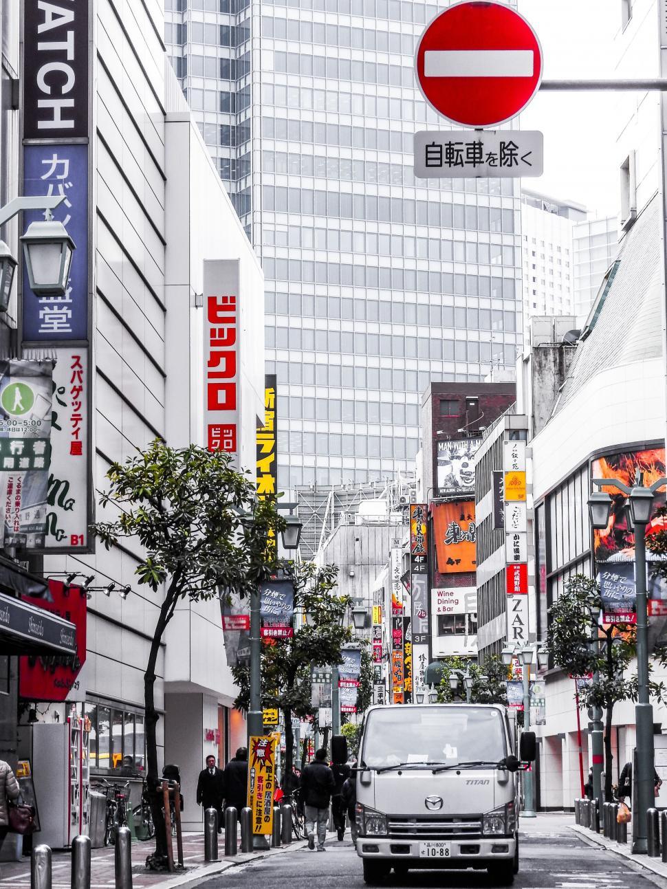 Free Image of Busy urban street with red stop sign 
