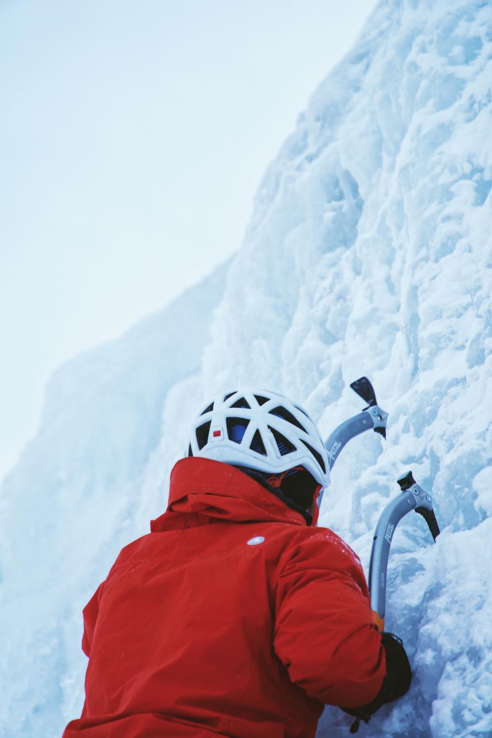 Free Image of Climber ascending a frozen waterfall 