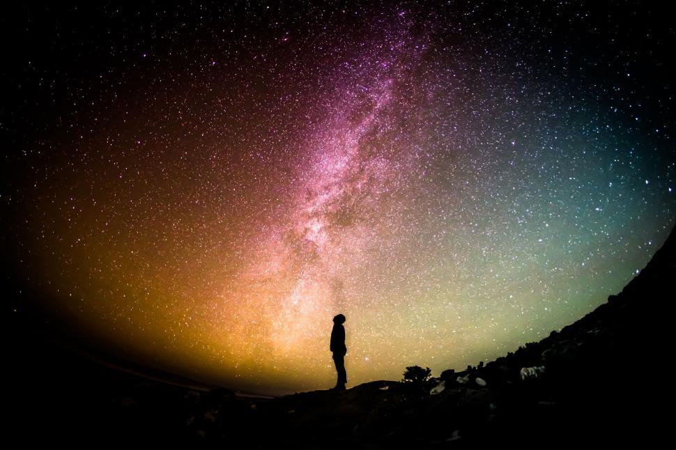 Free Image of Silhouette against a vibrant Milky Way 