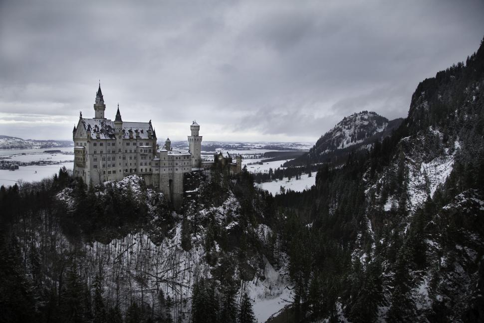 Free Image of Historic castle amidst snowy mountains 