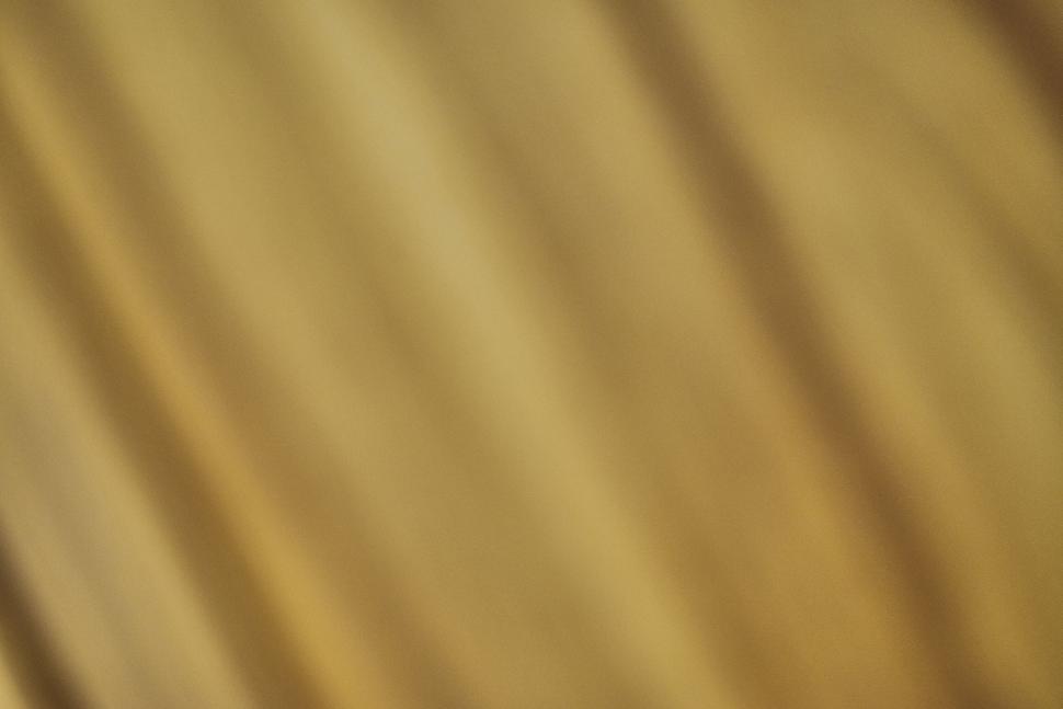 Free Image of Abstract golden lines on a blurred background 