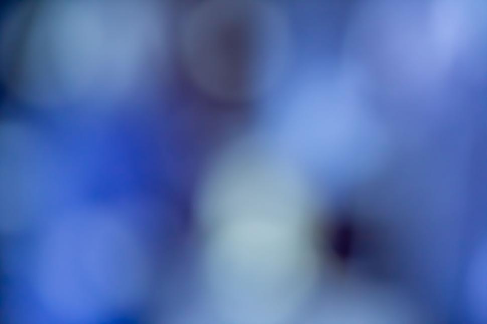 Free Image of Blurred bokeh lights on cool background 