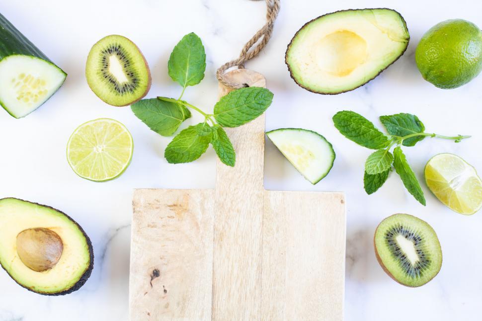 Free Image of Fresh fruits and wooden cutting board 