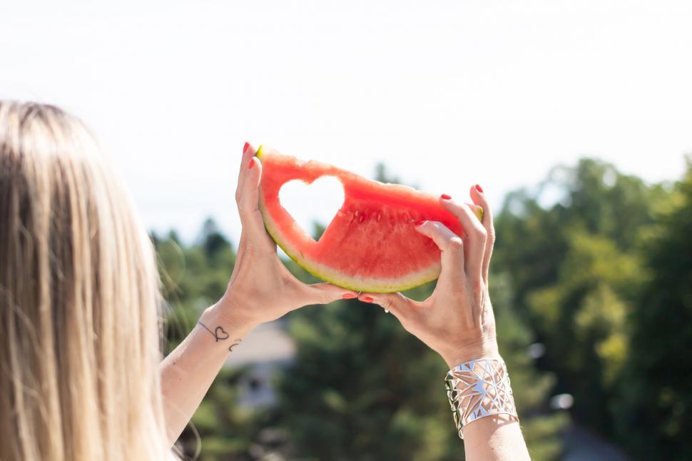 Free Image of Heart shape in watermelon slice against sky 
