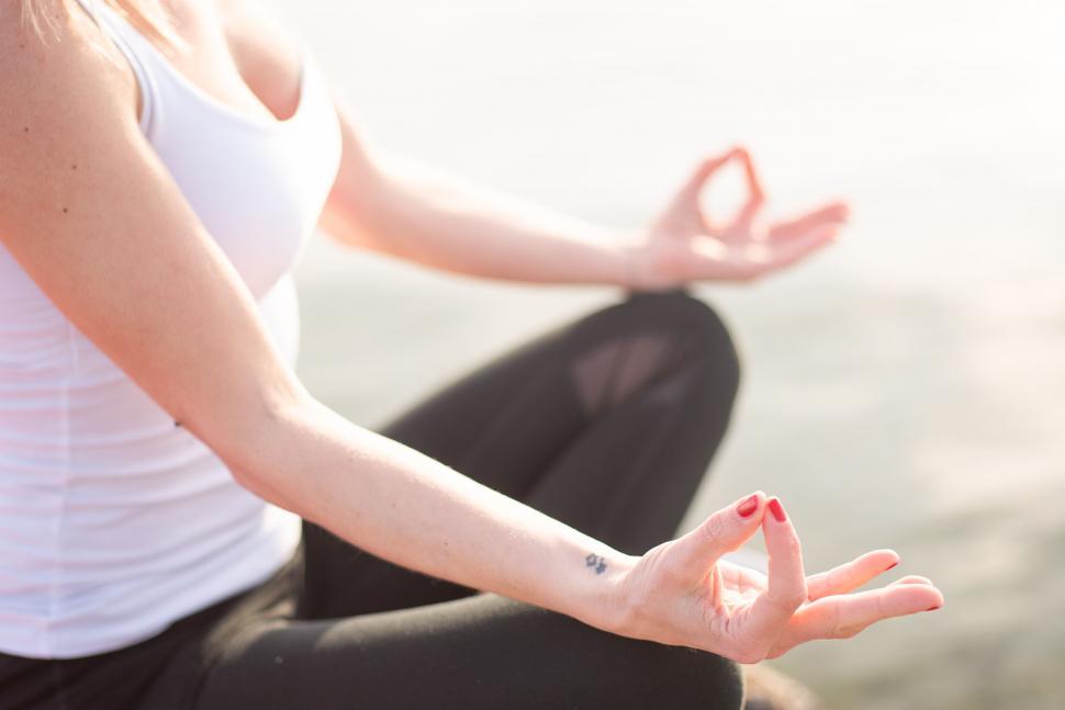 Free Image of Close-up of woman in yoga lotus pose 