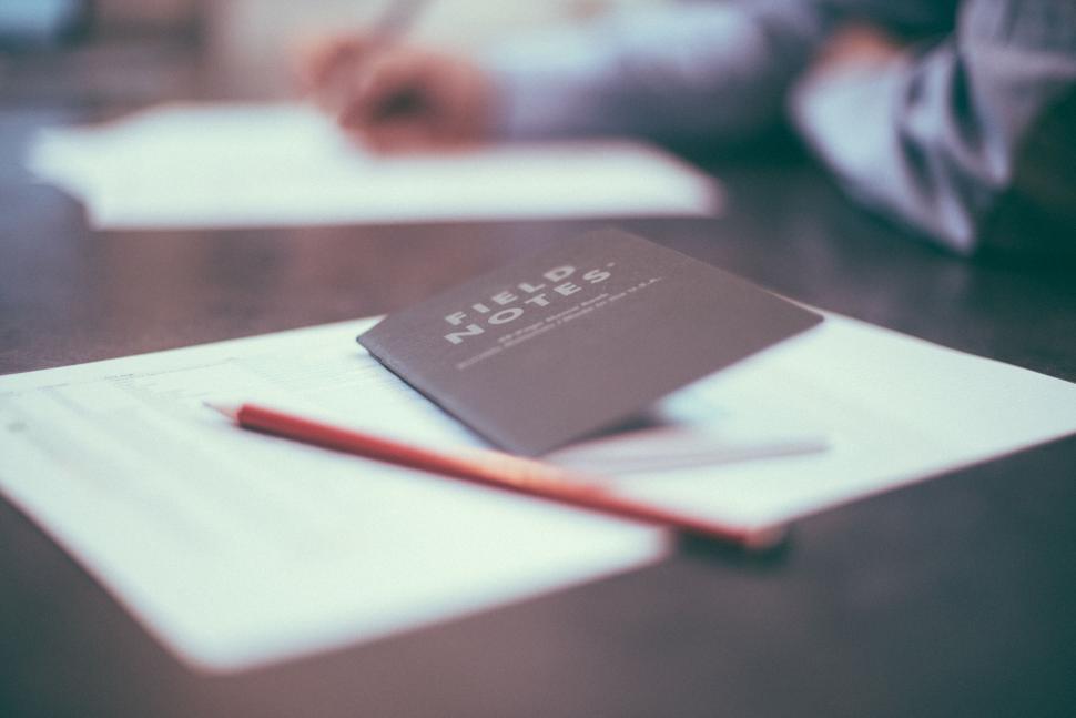 Free Image of Notebook with pencil on work desk 
