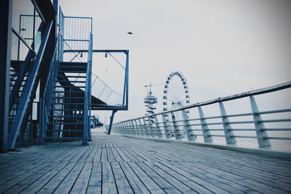 Free Image of Boardwalk view with ferris wheel in distance 