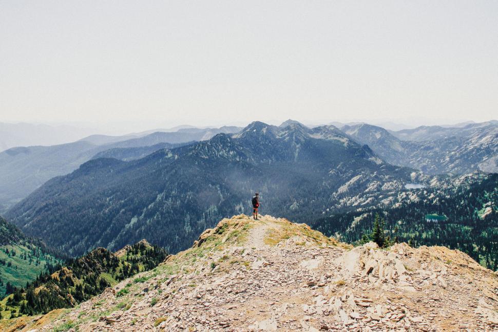 Free Image of Hiker on a mountain trail with scenic view 