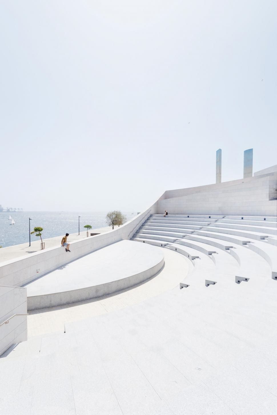 Free Image of Modern architecture by the sea with blue sky 