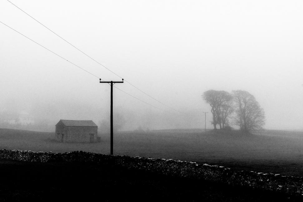 Free Image of Misty rural scene with a power line 