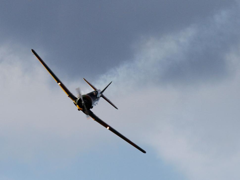 Free Image of Vintage aircraft flying with cloudscape 