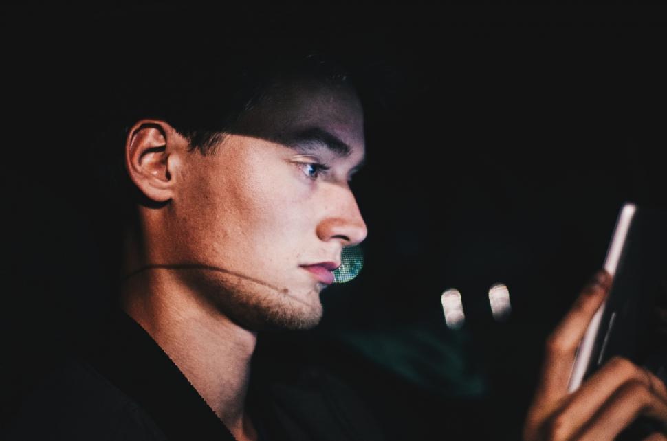 Free Image of Portrait of a man illuminated by screen 