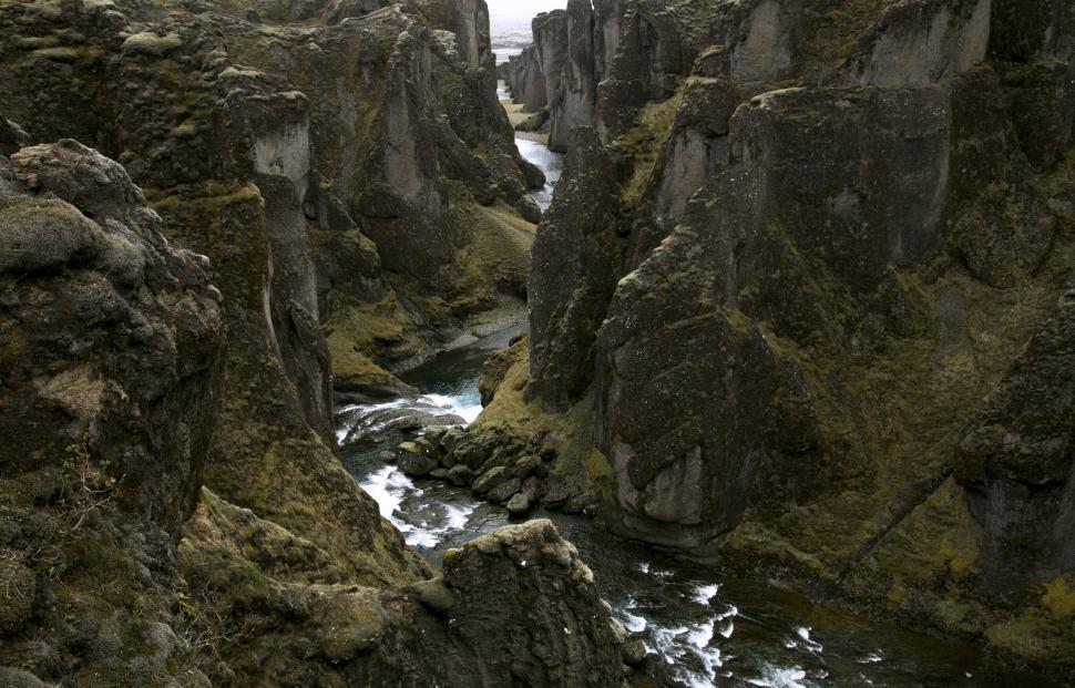 Free Image of Rugged canyon with flowing river 