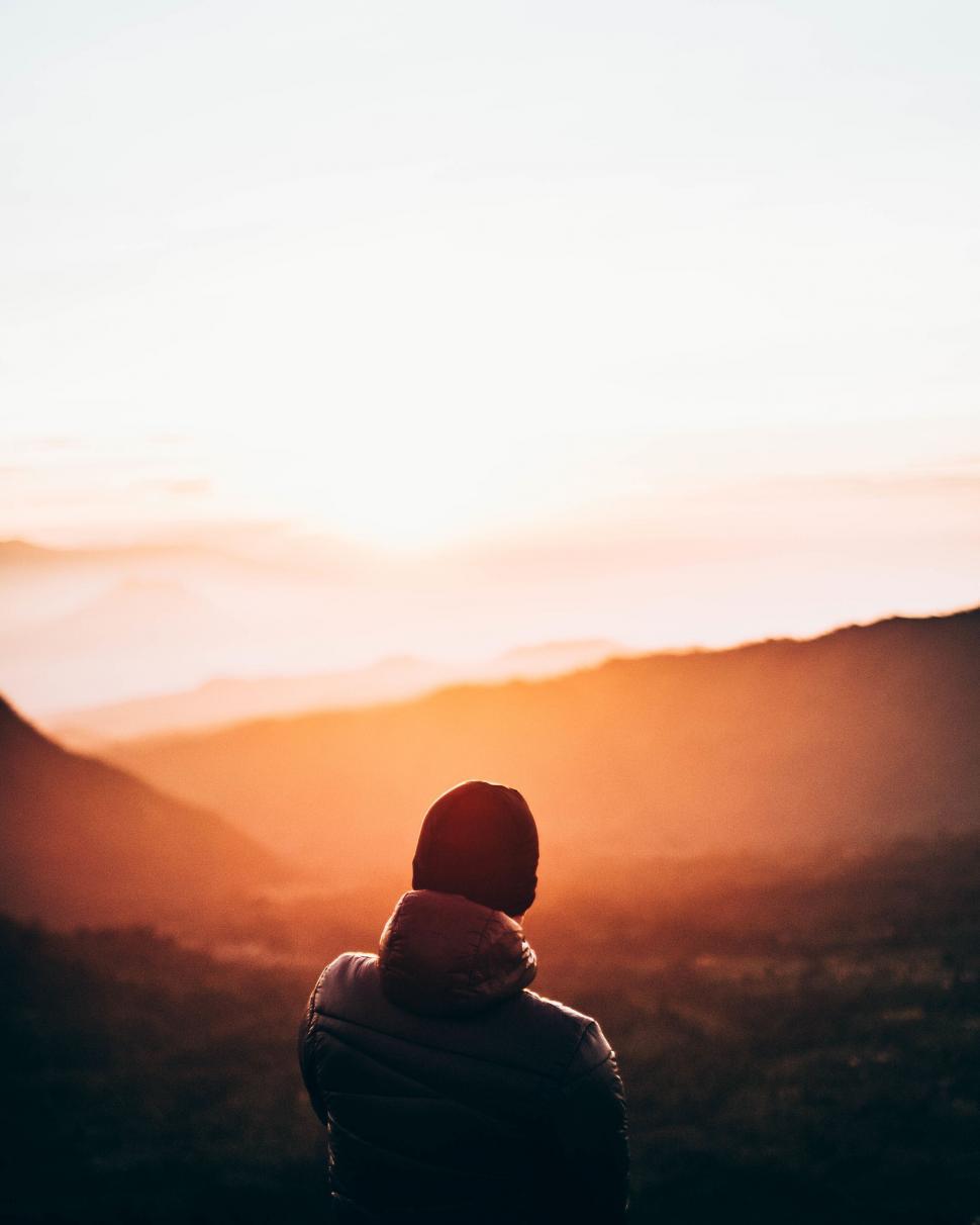 Free Image of Observer enjoying mountain sunrise 