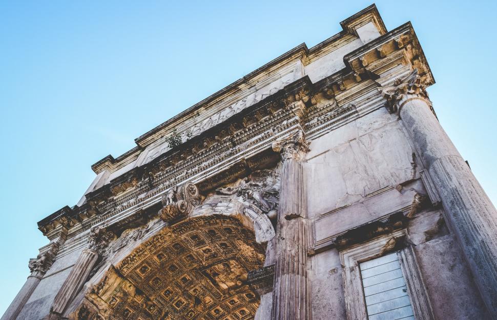 Free Image of Ancient Roman arch with intricate details 
