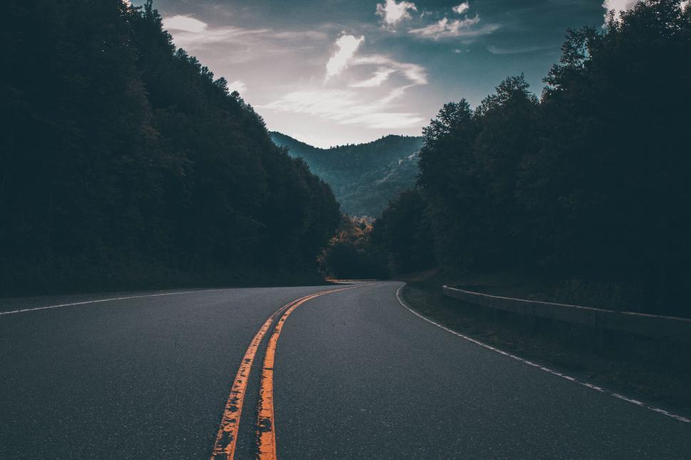 Free Image of Mountain road under a dusky sky 