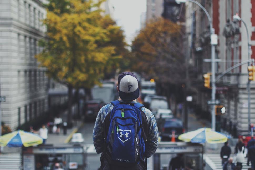 Free Image of Man overlooking city street from above 