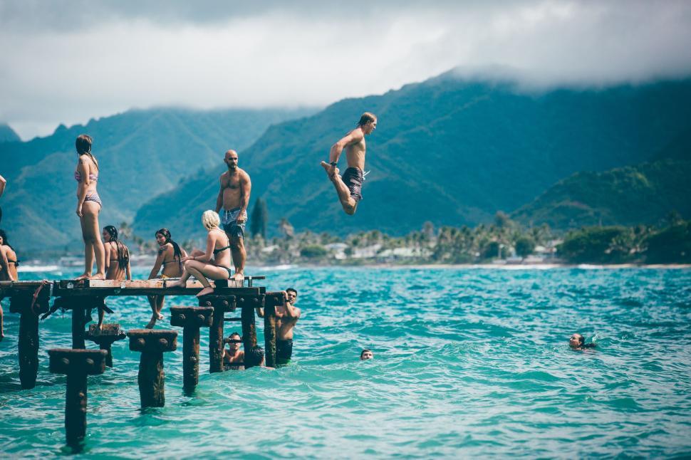 Free Image of People enjoying a sunny day at the pier 