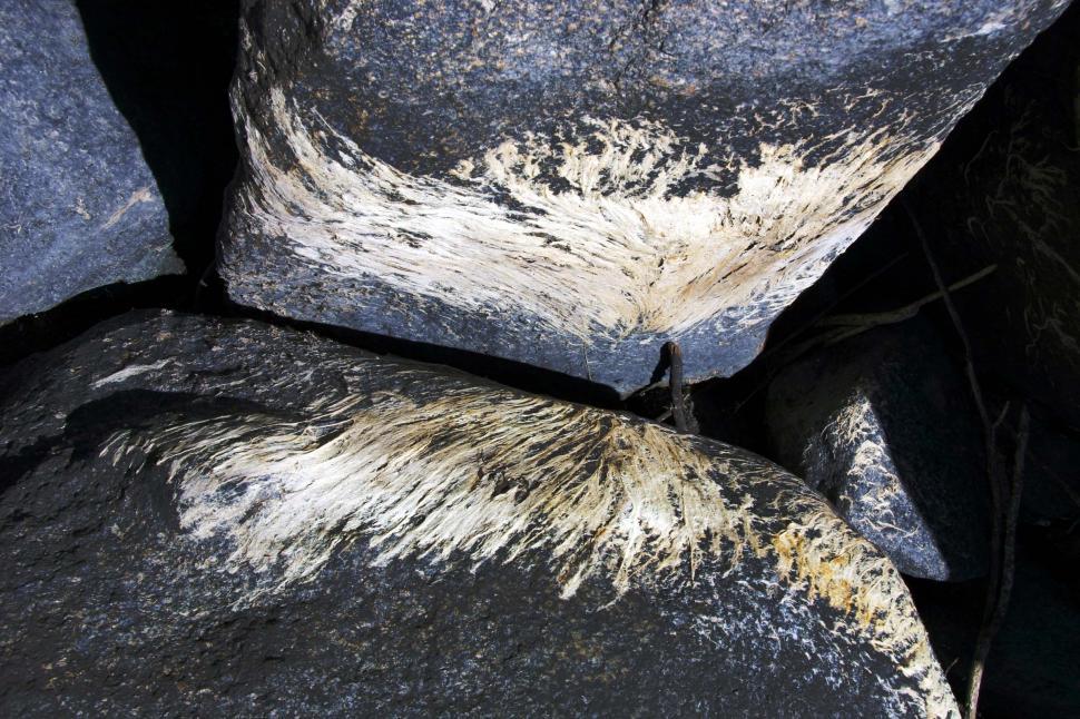 Free Image of Close Up of Rocks With White and Black Paint 