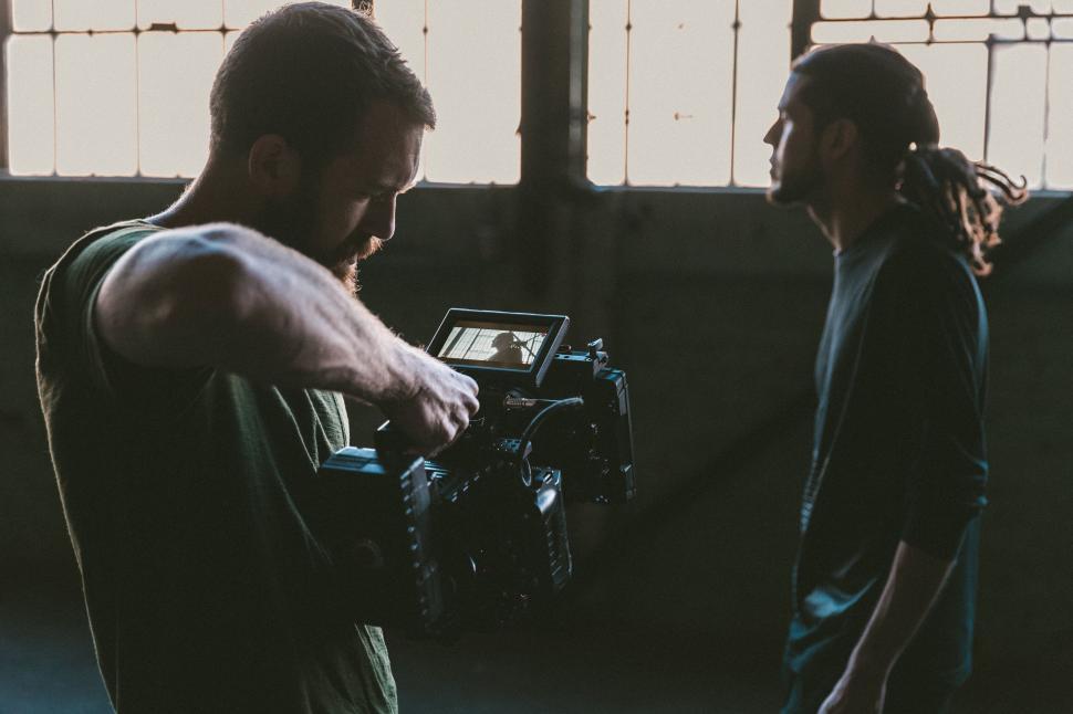 Free Image of Two people filming scene in a studio 