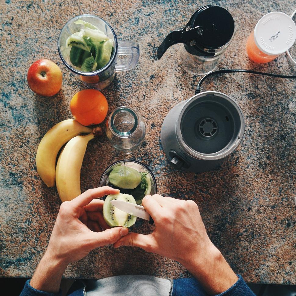 Free Image of Person preparing smoothie ingredients 
