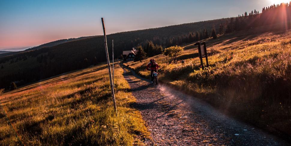 Free Image of Mountain biker on a scenic sundown trail 