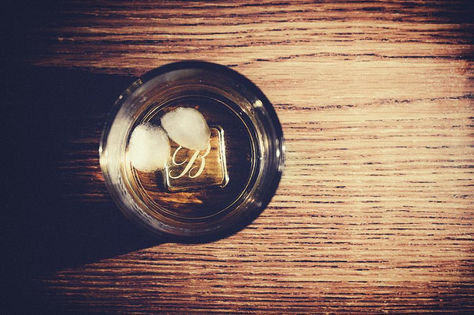 Free Image of Top view of a whiskey glass on wood 