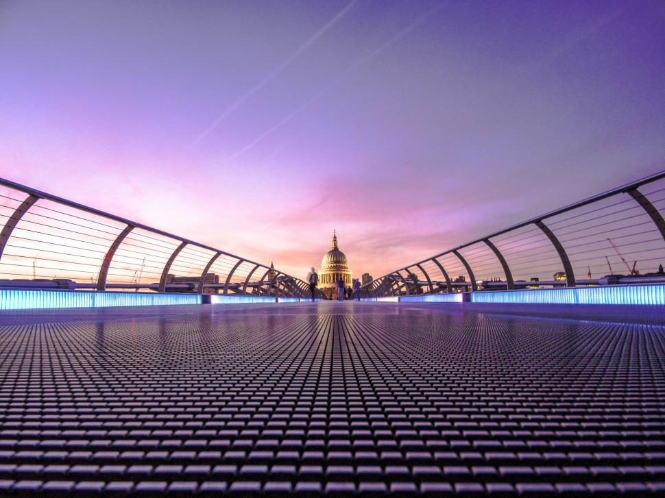 Free Image of Sunset view of a bridge leading to a dome 