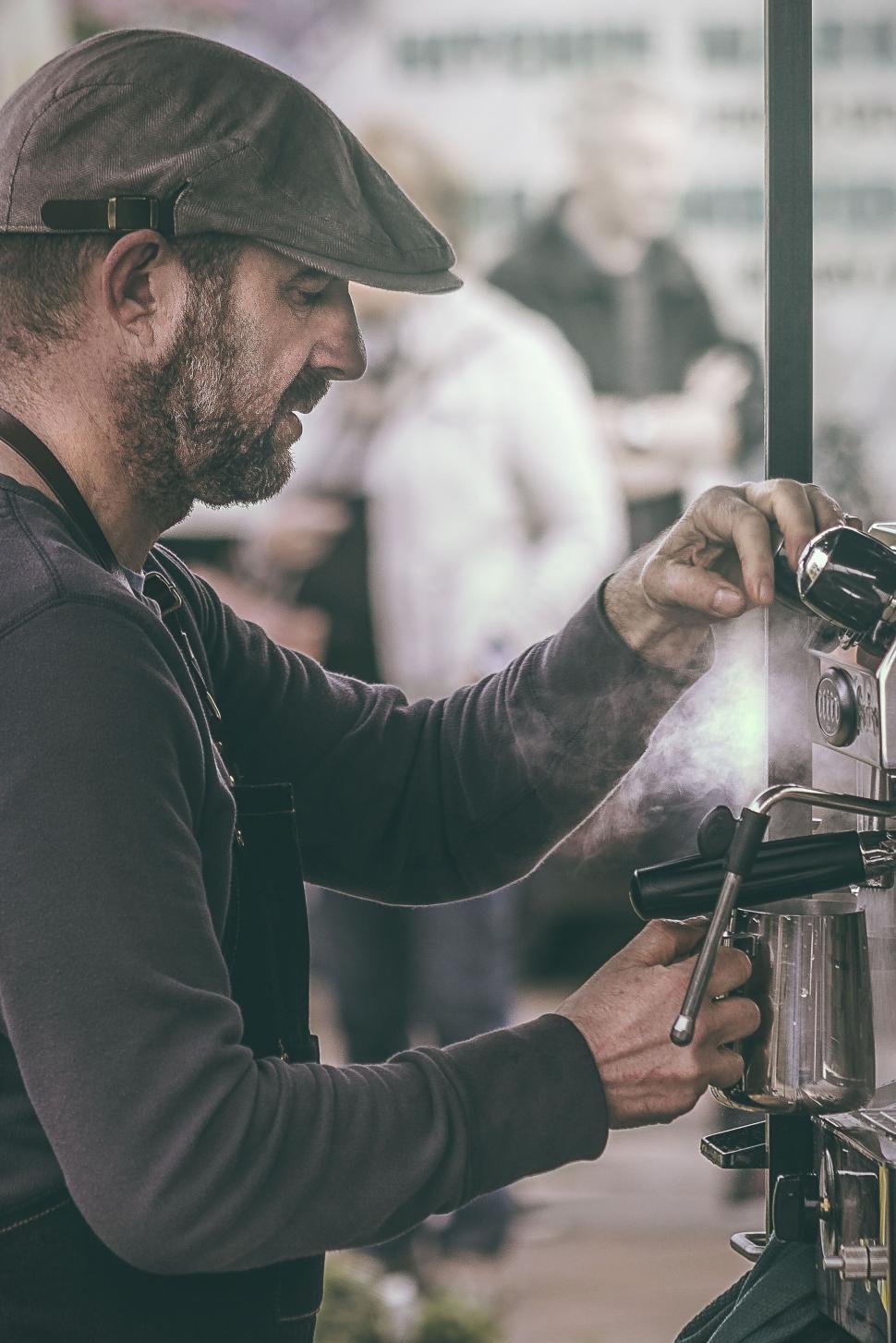 Free Image of Barista operating a coffee machine 