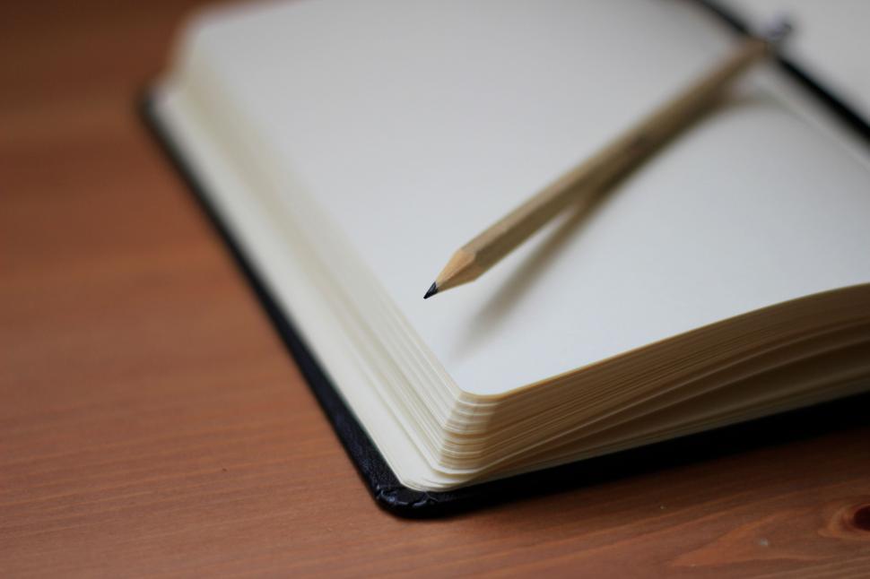 Free Image of Close-up of pencil on open notebook 