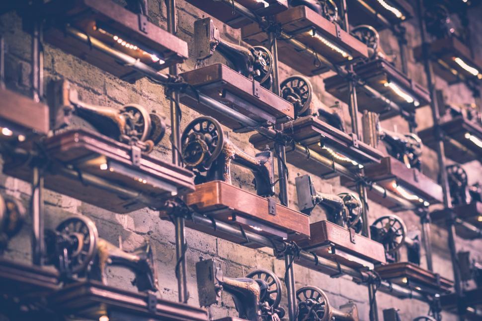 Free Image of Wall of antique sewing machines 