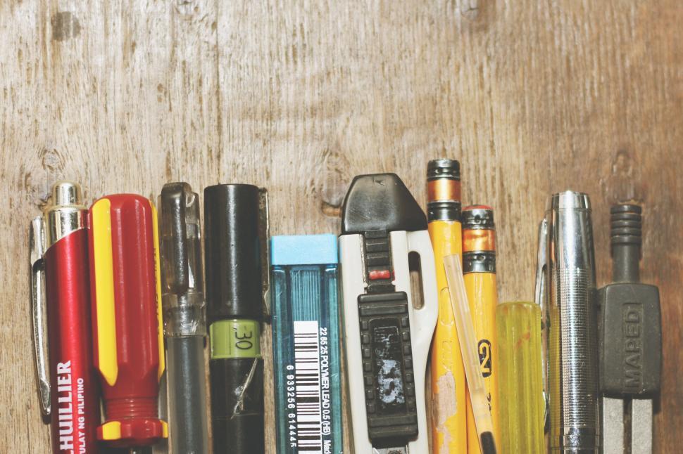Free Image of Assortment of writing and tool items close-up 