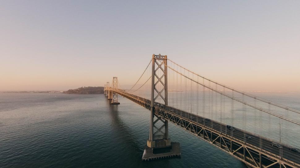 Free Image of Aerial view of a suspension bridge at dusk 