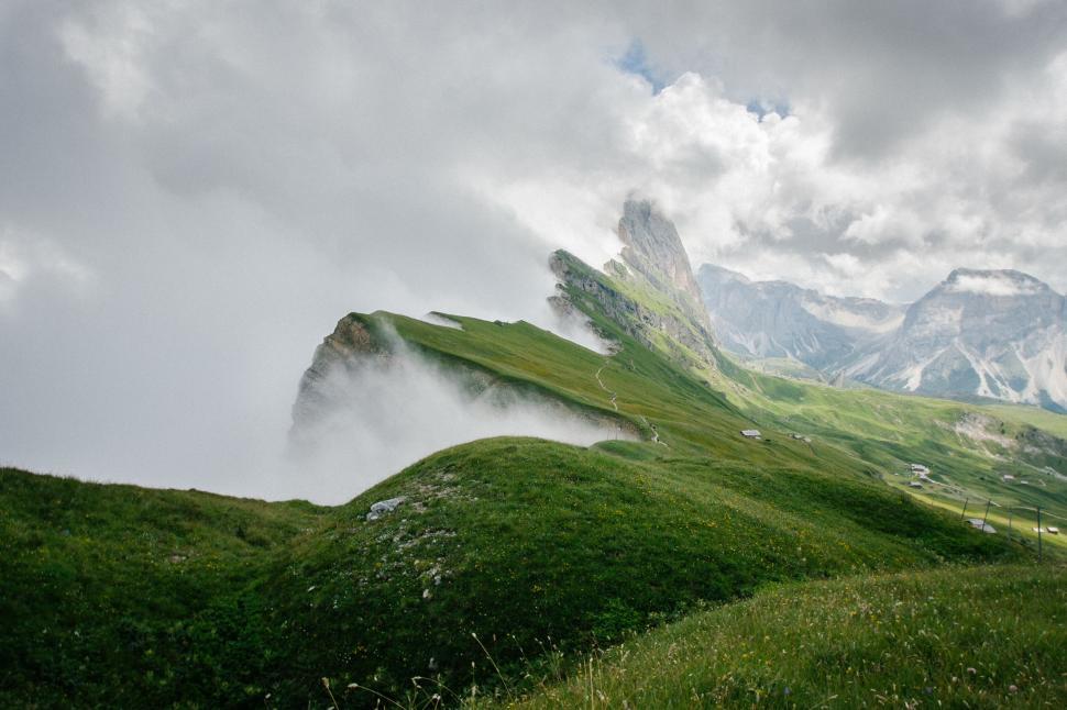 Free Image of Misty mountain landscape with green fields 