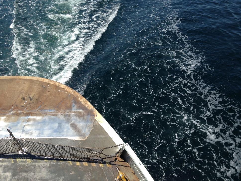 Free Image of Bow of a boat cutting through water 