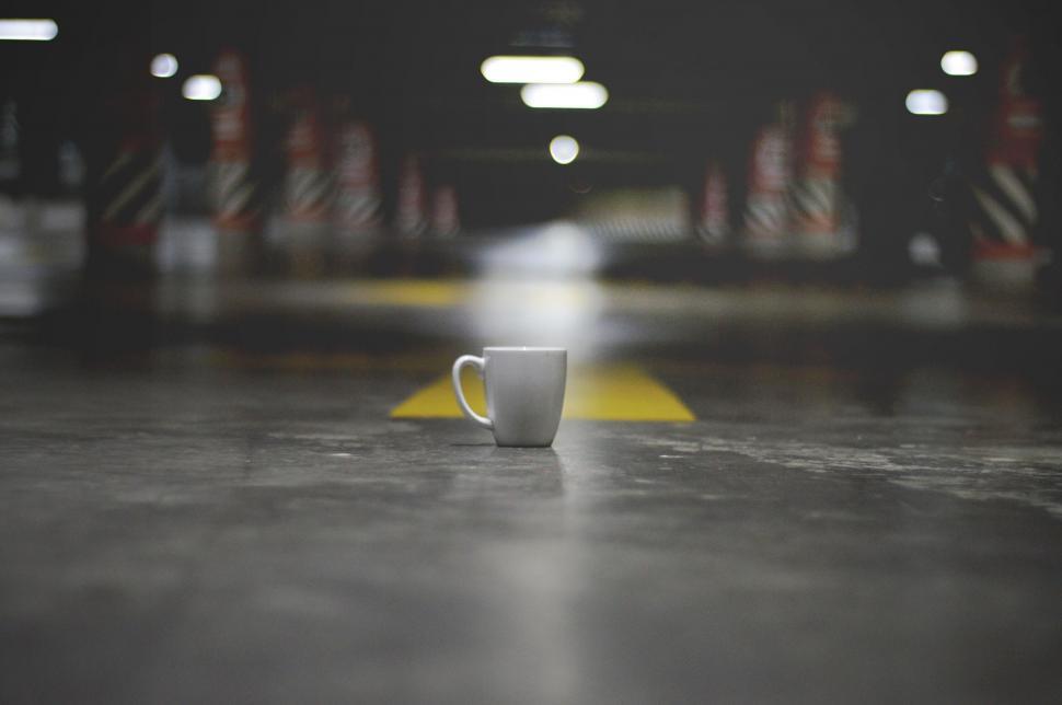 Free Image of Ceramic mug on urban ground marking 