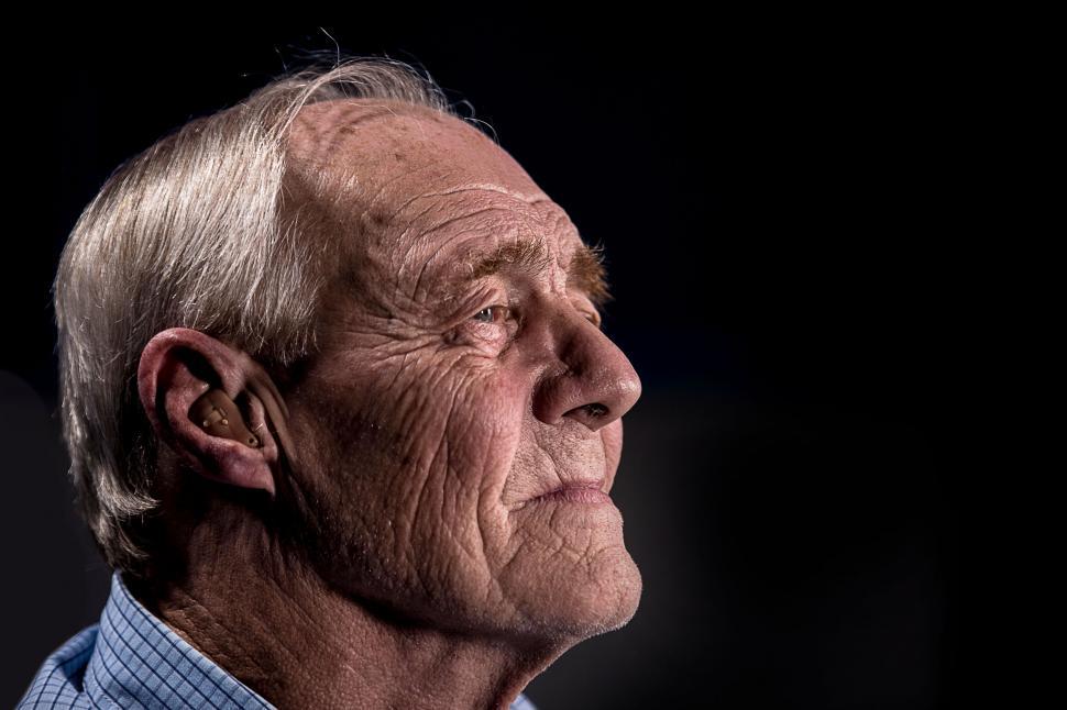 Free Image of Senior man with face obscured in shadow profile 