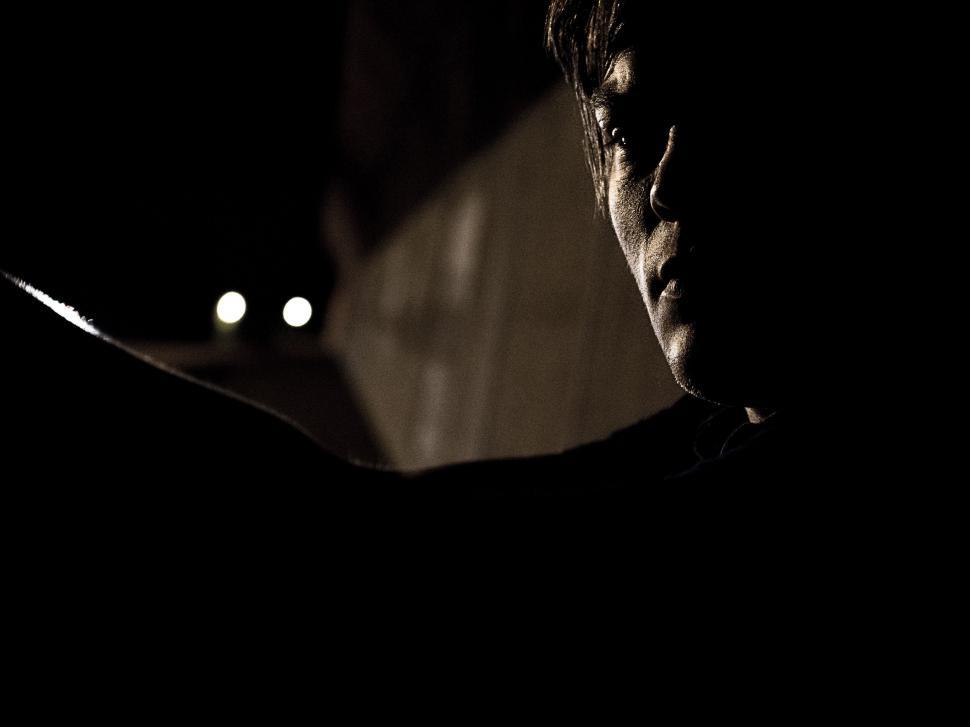 Free Image of Silhouette of a person in the shadows 