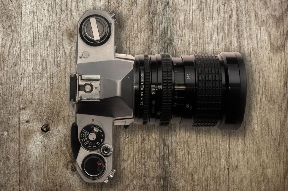 Free Image of Vintage camera on a wooden surface 