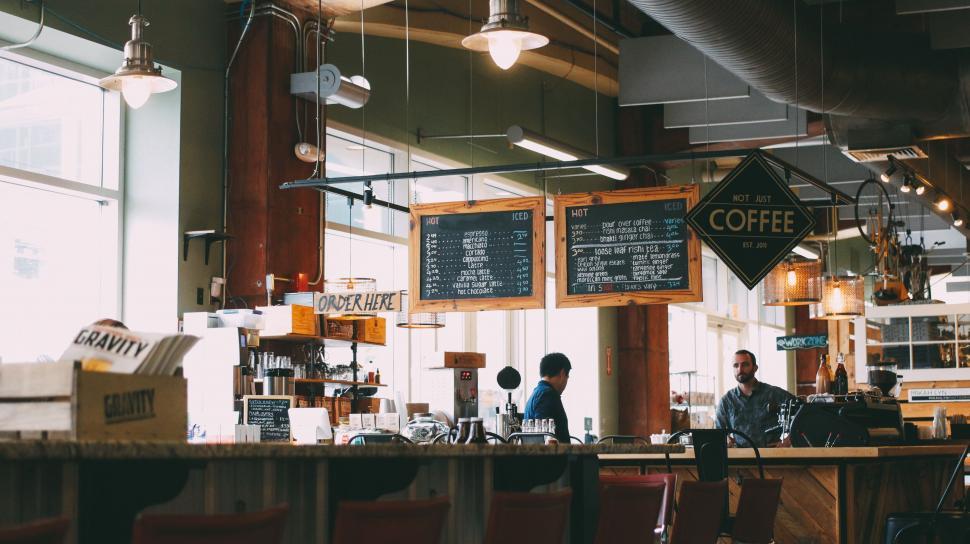Free Image of Lively cafe interior with coffee menus 